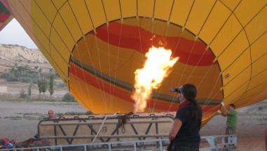 How does a hot air balloon inflated and flying?